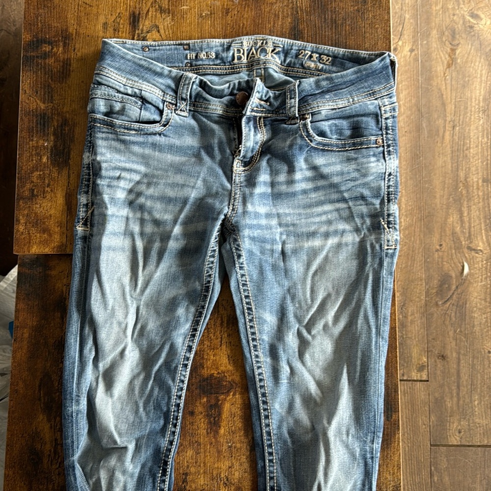 Buckle black skinny jeans